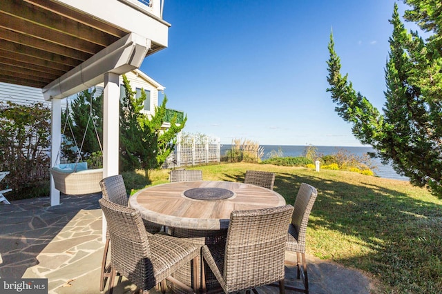 view of patio with a water view