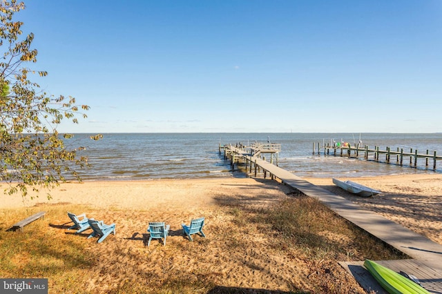 dock area featuring a view of the beach and a water view