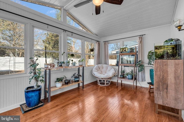 sunroom / solarium with lofted ceiling, a wealth of natural light, and ceiling fan