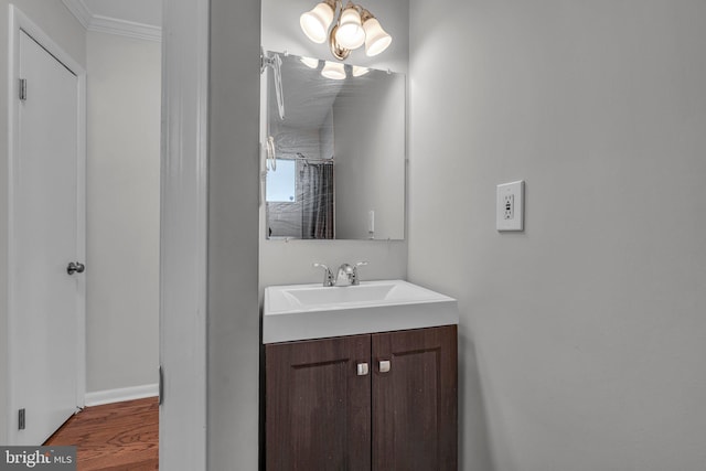 bathroom with hardwood / wood-style flooring and vanity