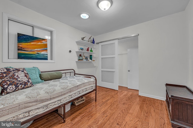 bedroom with light wood-type flooring