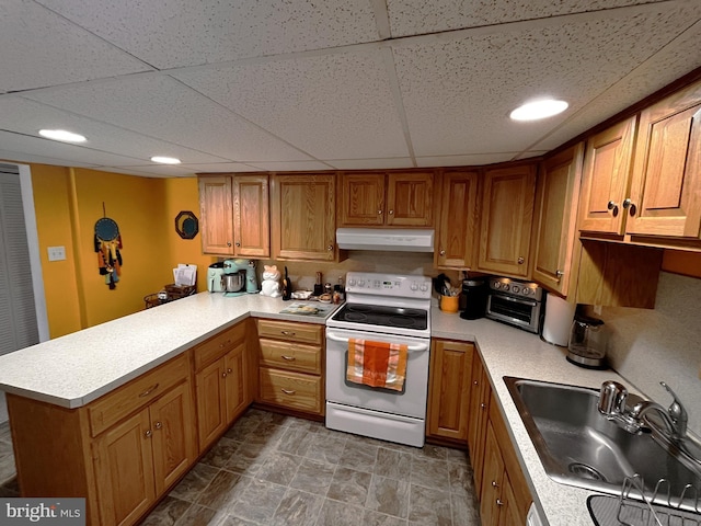 kitchen featuring a paneled ceiling, sink, white electric range oven, and kitchen peninsula