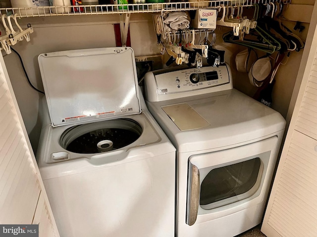 washroom featuring washer and dryer