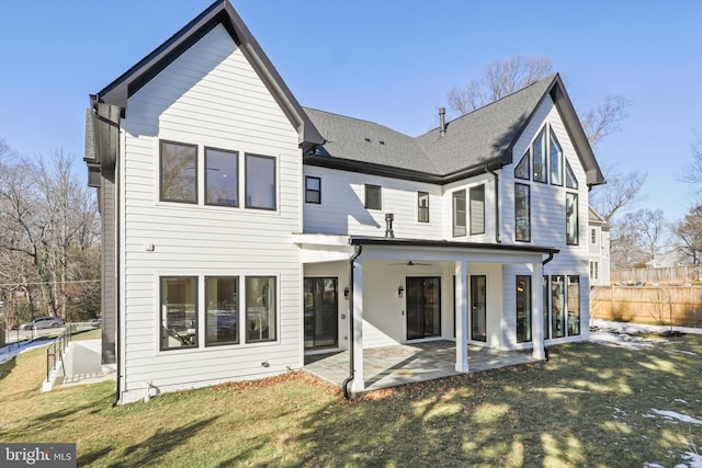 rear view of property featuring a yard, a patio, and ceiling fan