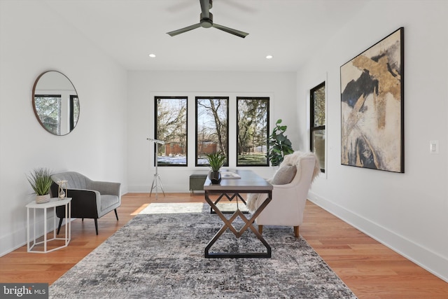 sitting room featuring hardwood / wood-style floors and ceiling fan