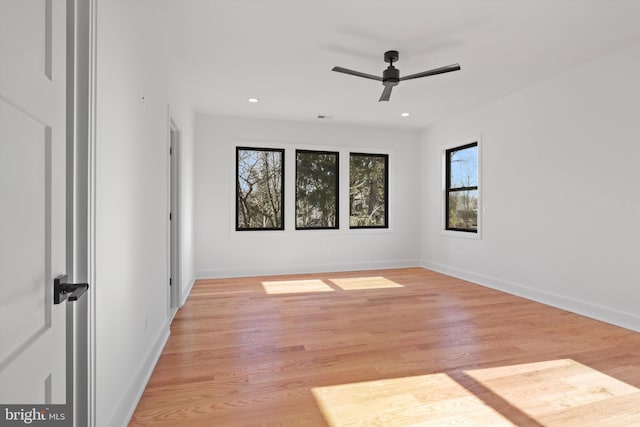 spare room with light hardwood / wood-style floors and ceiling fan