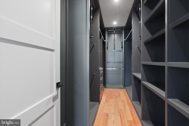 walk in closet featuring hardwood / wood-style floors