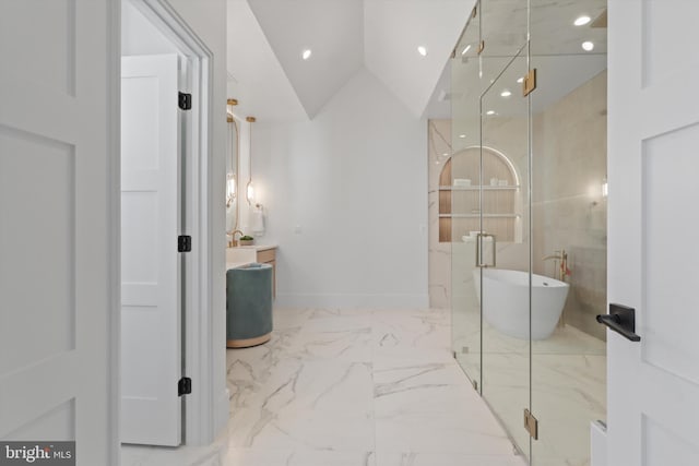 bathroom featuring lofted ceiling and separate shower and tub