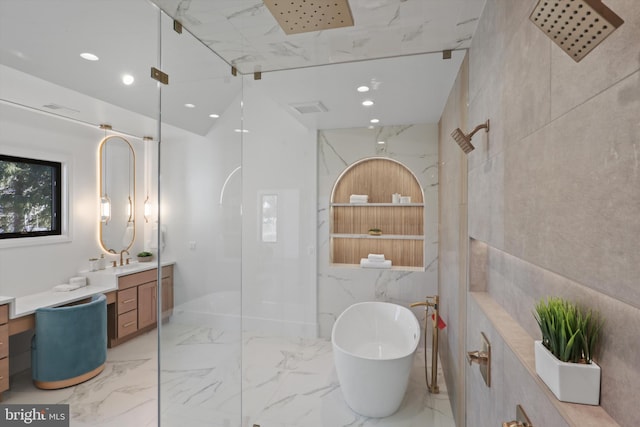 bathroom featuring vanity and shower with separate bathtub