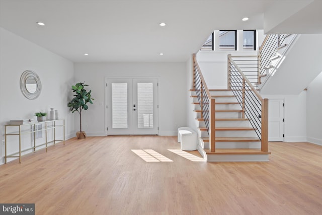 entryway with light hardwood / wood-style flooring and french doors