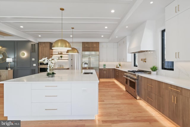 kitchen featuring white cabinetry and pendant lighting