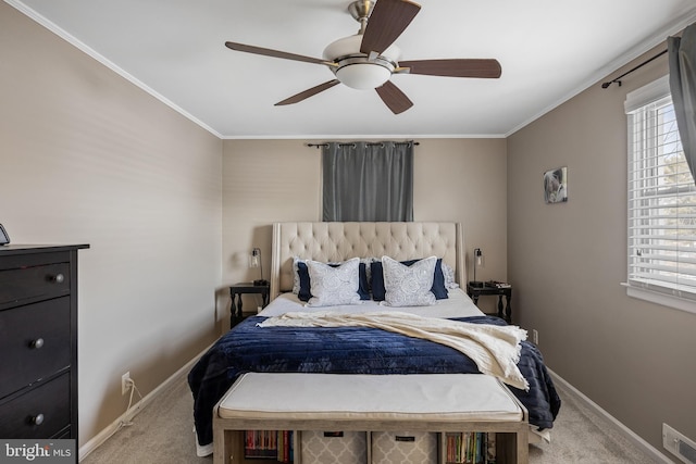 carpeted bedroom with crown molding and ceiling fan