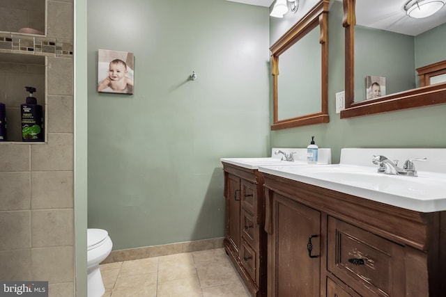 bathroom featuring tile patterned floors, vanity, and toilet