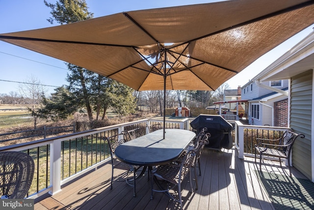 wooden terrace with grilling area