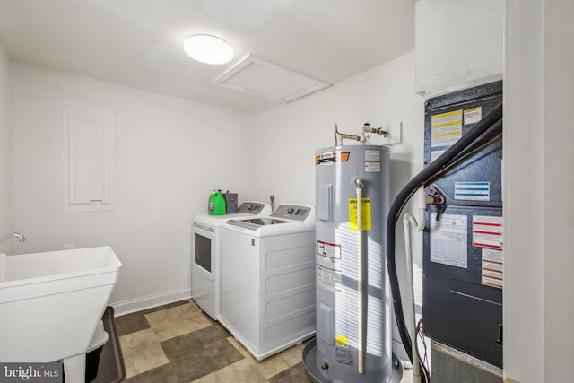 washroom with independent washer and dryer, sink, and electric water heater