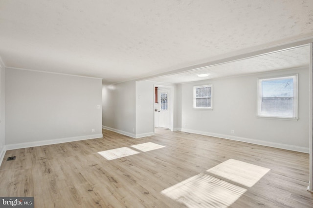 spare room featuring light wood-type flooring