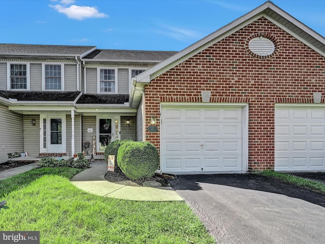 view of front of home featuring a garage and covered porch