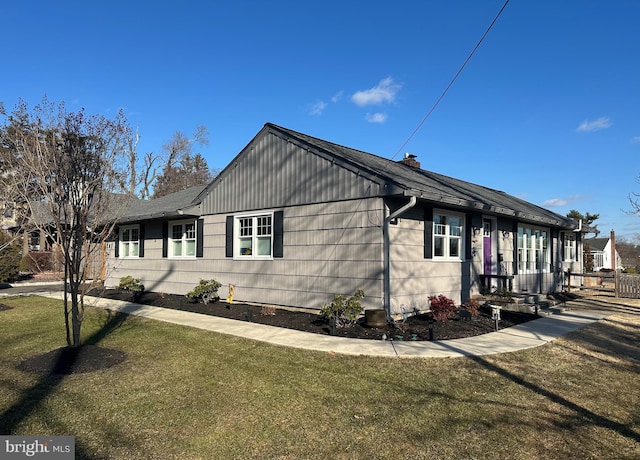 view of property exterior with a yard