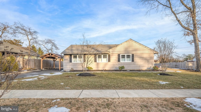 single story home featuring a gazebo and a front lawn