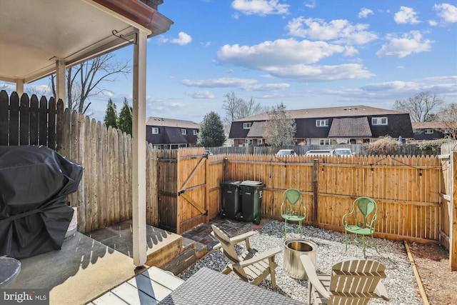 view of patio / terrace featuring area for grilling and fence