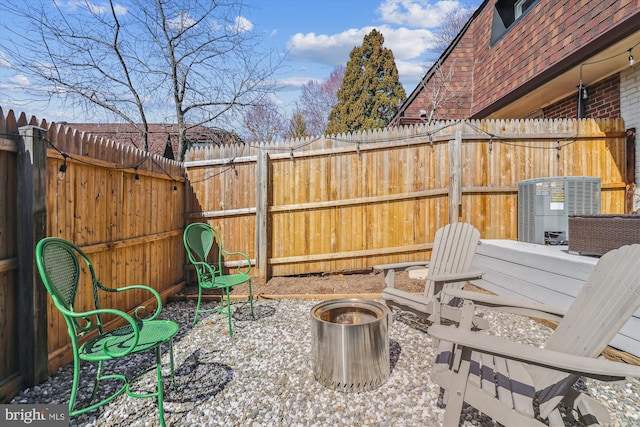 view of patio with central AC unit and a fenced backyard