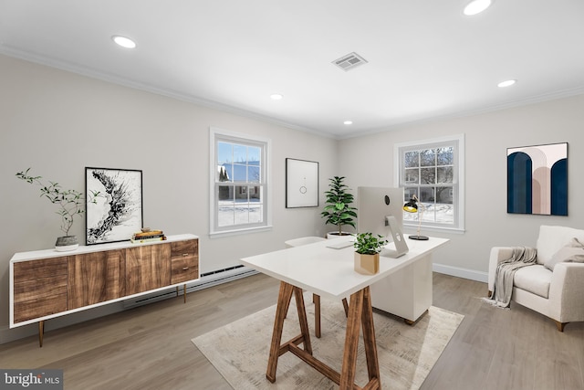 dining space featuring crown molding and light hardwood / wood-style flooring