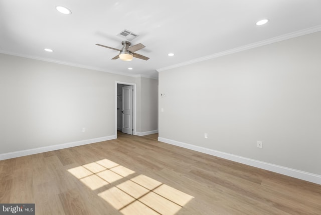 spare room with crown molding, ceiling fan, and light hardwood / wood-style flooring