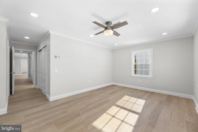 unfurnished room with ceiling fan, ornamental molding, and light wood-type flooring