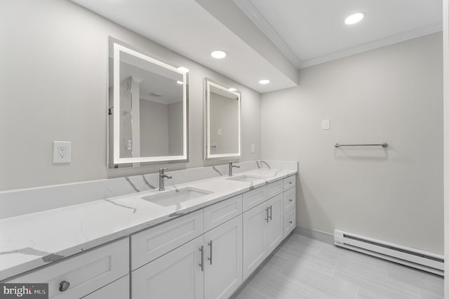 bathroom with baseboard heating, ornamental molding, and vanity