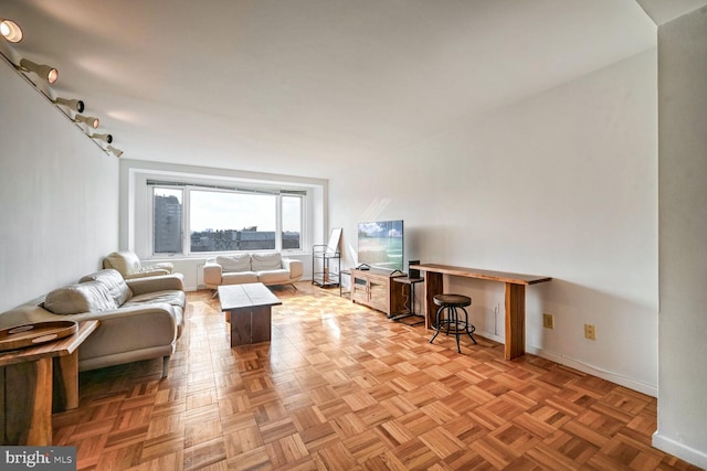 unfurnished living room with light parquet floors