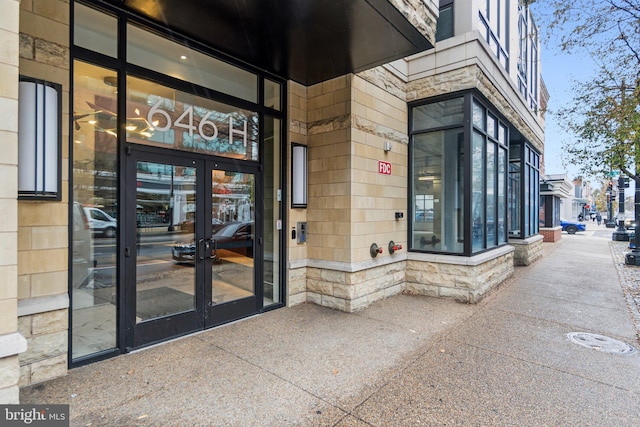 view of exterior entry featuring french doors