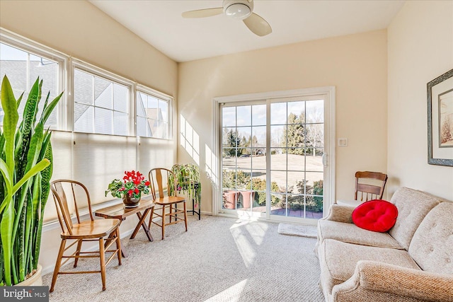 sunroom featuring ceiling fan and a wealth of natural light