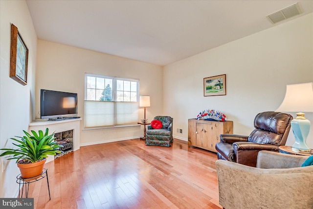 sitting room with hardwood / wood-style floors