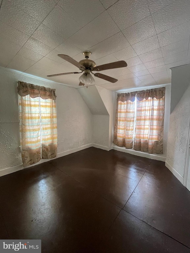 bonus room with vaulted ceiling and ceiling fan