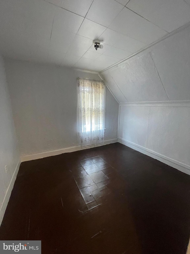 bonus room featuring vaulted ceiling