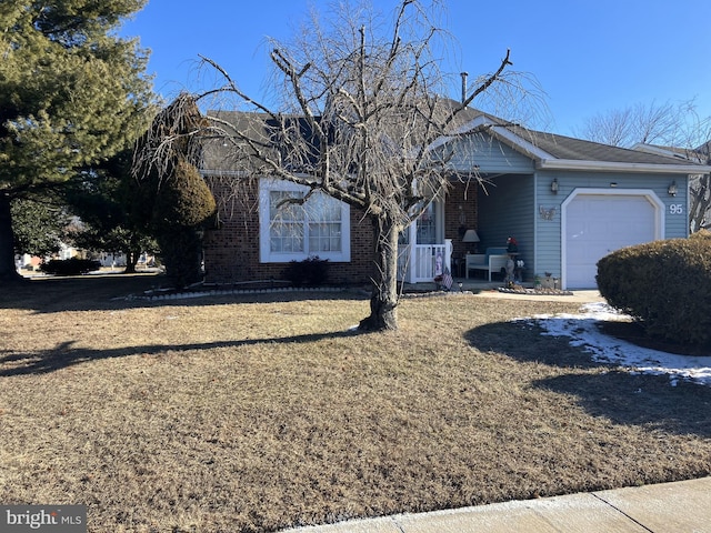 view of front of home featuring a garage and a front yard