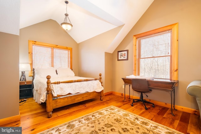 bedroom featuring vaulted ceiling and hardwood / wood-style floors