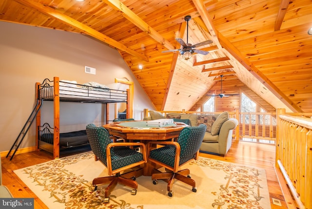 bedroom featuring wood ceiling, lofted ceiling with beams, and light hardwood / wood-style flooring