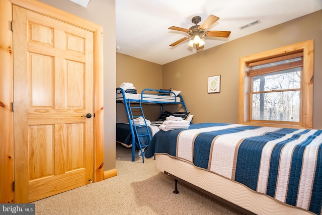 carpeted bedroom featuring ceiling fan