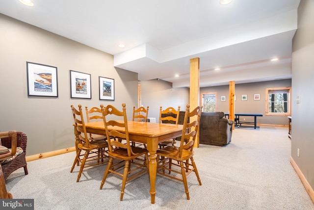 dining room featuring light carpet