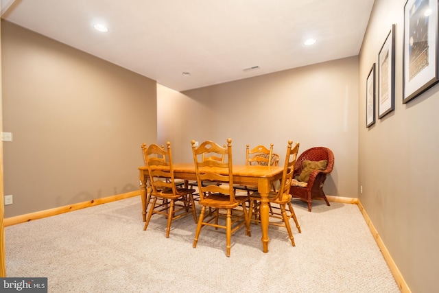 view of carpeted dining space