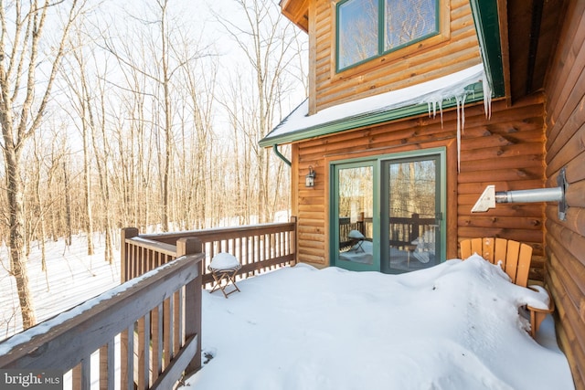 view of snow covered deck