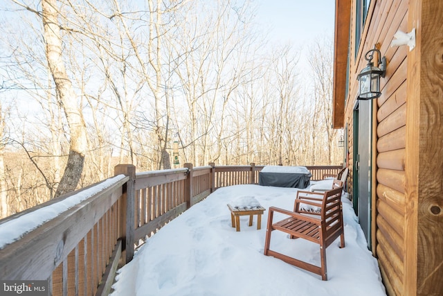 view of snow covered deck