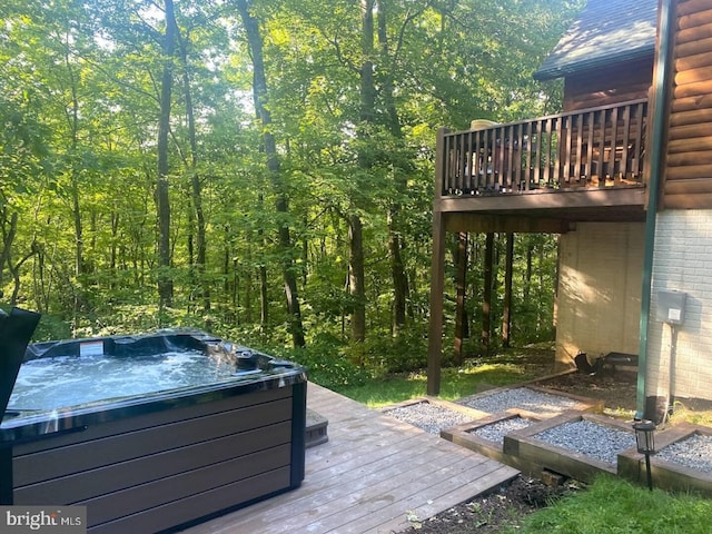 deck featuring a hot tub