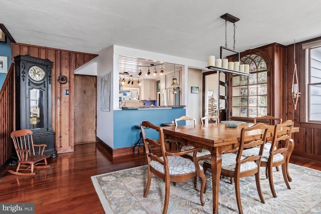 dining room with dark wood-type flooring