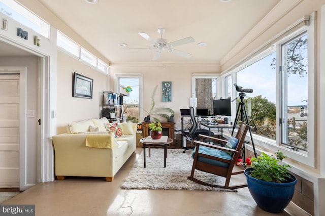 sunroom / solarium featuring ceiling fan