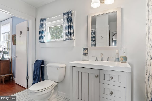 bathroom featuring tile patterned floors, vanity, toilet, and a shower with shower curtain