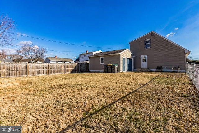 back of property featuring a yard