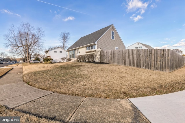 view of property exterior with a lawn