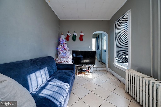 tiled living room with radiator heating unit